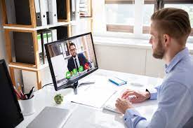 Image of man and lawyer video conferencing in front of a computer for ProVideoMeeting
